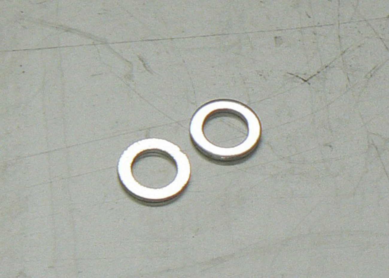 PODLOZKA VYPOUSTECIHO SROUBU 10X16X1,5